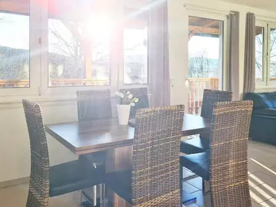 a dining room with a wooden table and chairs at 5 person holiday home in LONEVÅG-By Traum in Lonevåg