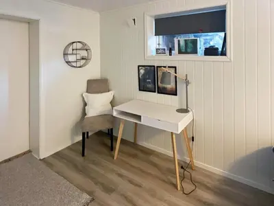 a desk and a chair in a room at 6 person holiday home in AVERØY-By Traum in Stein