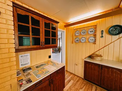 a kitchen with a counter and some plates on the wall at Svingen Guesthouse - Panoramic Fjord Views in Flåm in Flåm