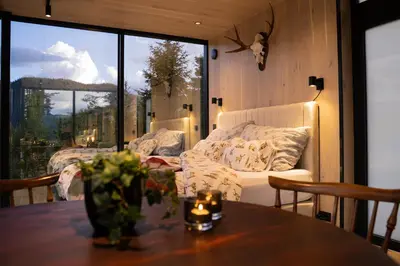 a living room with a couch and a table at Vidsyn Midjås in Vistad