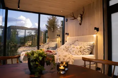 a living room with a couch and a table at Vidsyn Midjås in Vistad