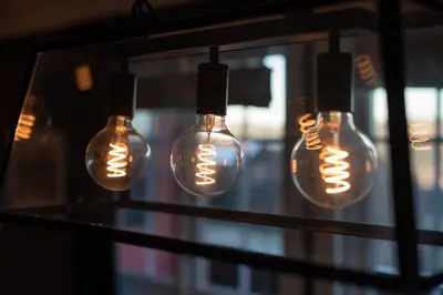 a group of light bulbs hanging from a window at Storsten 730 in Trysil