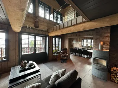 a living room with a couch and a fireplace at Roalden Mountain Lodge in Stranda