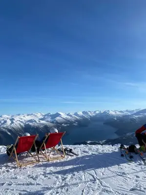 two chairs sitting on top of a snow covered mountain at Roalden Mountain Lodge in Stranda
