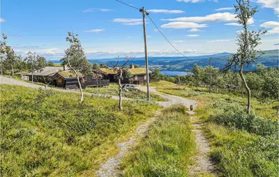 a dirt road leading to a house on a hill at 3 Bedroom Lovely Home In Beitostølen in Beitostøl
