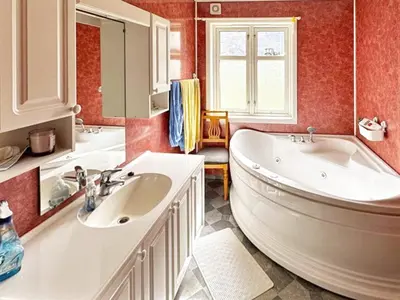 a bathroom with a large tub and a sink at 6 person holiday home in Gudvangen-By Traum in Gudvangen