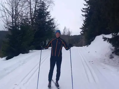 a man is standing on skis in the snow at 6 person holiday home in HURDAL-By Traum in Hurdal