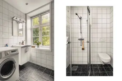 a bathroom with a shower and a washing machine at Modern Apartment in the center of Bergen in Bergen