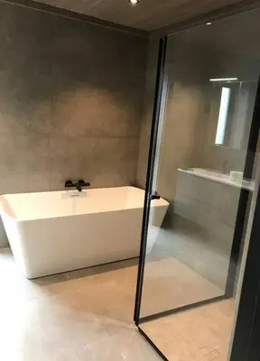a bathroom with a white tub and a sink at Resvegen 63 in Stranda