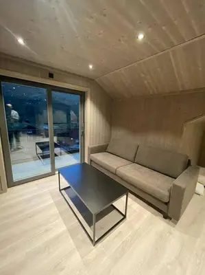 a living room with a couch and a coffee table at Resvegen 63 in Stranda