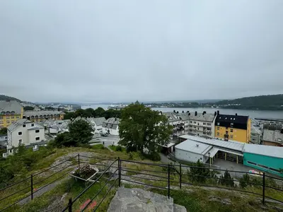 a view of a town with a river and buildings at Leilighet i Ålesund. in Ålesund