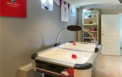 a hospital room with a table with a machine at Pet Friendly Apartment In Tresfjord in Tresfjord