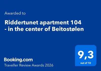 a blue sign with the text authorized to rebate appointment in the center at Riddertunet apartment 104 - in the center of Beitostølen in Beitostøl