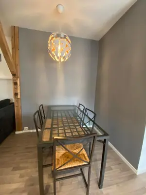 a dining room with a glass table and chairs at Leilighet Sølendet, i Brekken ved Røros in Røros