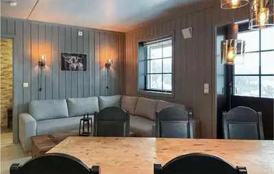 a living room with a couch and a table at Beautiful Apartment In Noresund in Noresund