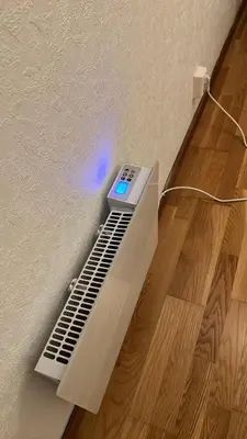 a remote control sitting on top of a wall at Apartment in Åsane in Bergen