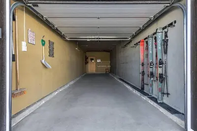 a hallway with skis on the wall in a building at Skarsnuten Panorama 46 in Hemsedal