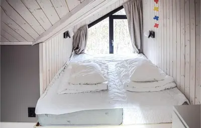 a bed in a room with a window at 5 Bedroom Nice Home In Hemsedal in Hemsedal