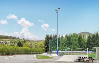 a skate park with a bench and a street light at Gorgeous Home In Skjold With Kitchen in Skjold