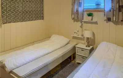 a small room with two beds and a window at Cozy Apartment In Gol With Wifi in Gol