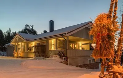 a house in the snow with lights on at Cozy Apartment In Gol With Wifi in Gol