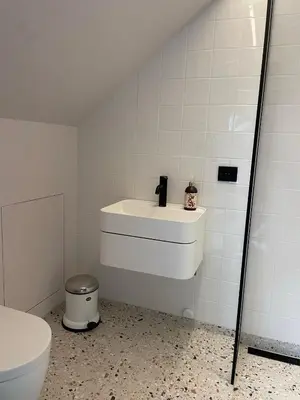 a bathroom with a sink and a toilet at Tomannsbolig på Rosenborg in Trondheim