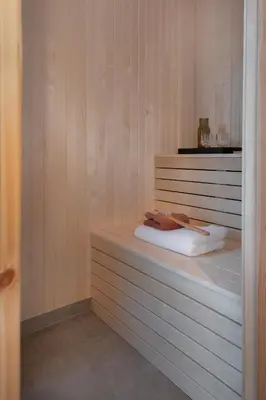 a room with a bed with avisor at Luxury Nordic Suite with Private Sauna and Panoramic Mountain Views in Stranda