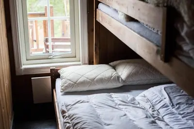 a bunk bed in a room with a window at Luxury cabin in the mountains with all facileties in Sønstebø
