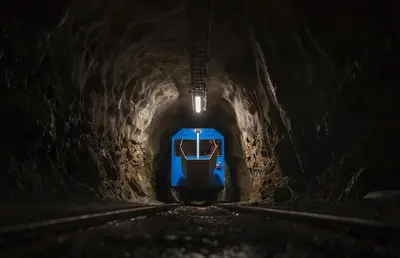 a blue train traveling through a tunnel at night at Luxury cabin in the mountains with all facileties in Sønstebø