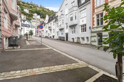 an empty street in a city with buildings at Family Friendly - Modern - City Central in Bergen