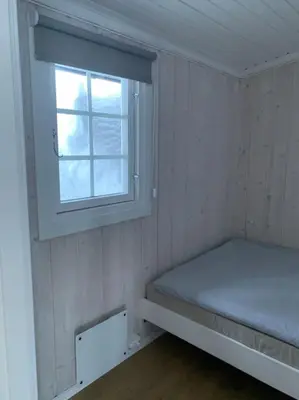 a small room with a bed and a window at Holiday home in beautiful Sjusjøen, near Lillehammer in Ringsaker