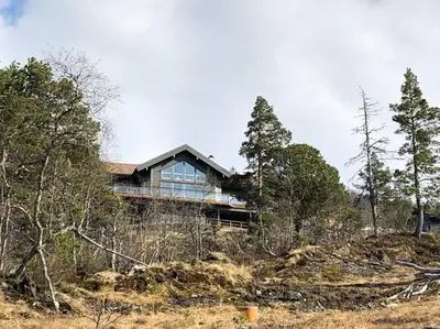 a house on top of a hill with trees at Bordalen-Voss in Rjoo
