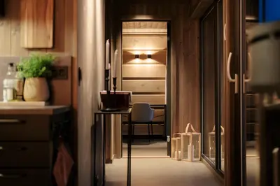 a hallway with a table and a chair in a kitchen at Dream Cabin Mivo X - Mountain Views and Idyllic Location at Strandafjellet in Stranda