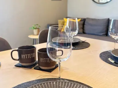 a table with two wine glasses on top of it at 4 person holiday home in GEILO-By Traum in Geilo