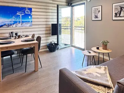 a living room with a table and a couch at 4 person holiday home in GEILO-By Traum in Geilo