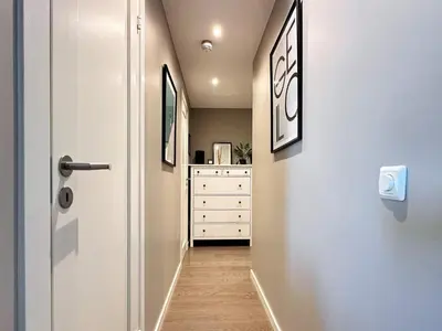 a hallway with a white door and a dresser at 4 person holiday home in GEILO-By Traum in Geilo