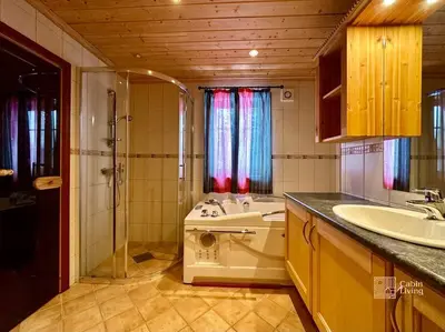 a bathroom with a toilet and a sink and a shower at Large cabin with Sjusjøens best view, sauna and ski in out in Ringsaker
