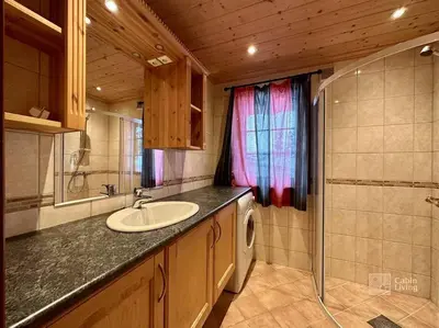 a bathroom with a sink and a counter top at Large cabin with Sjusjøens best view, sauna and ski in out in Ringsaker