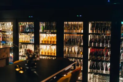 a room filled with lots of bottles of wine at Biologen Herdla in Askøy