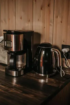 a coffee maker and a coffee pot on a counter at Nydelig moderne hytte på Geilo Kikut med høy standard - 4 senger 6 gjester in Geilo