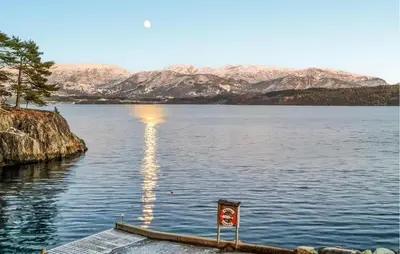a view of a lake with mountains in the background at 3 Bedroom Nice Home In Os in Oma
