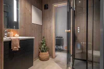 a bathroom with a sink and a shower with a christmas tree at 7 Min to Fjord - Alpine Stay in Stranda in Stranda