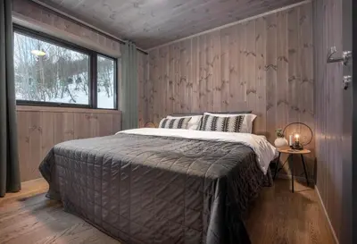 a bedroom with a bed in a room with a window at 7 Min to Fjord - Alpine Stay in Stranda in Stranda