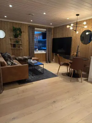 a living room with a couch and a table at Nice apartment on Geilotunet, Close to city center in Geilo