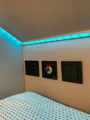 a bedroom with a bed with two records on the wall at Olden apartments 3, penthouse. in Olden