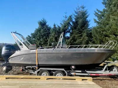 a silver boat on a trailer on a truck at 6 person holiday home in Ånneland-By Traum in Ånneland