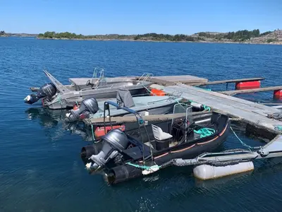 a boat is docked at a dock in the water at 6 person holiday home in Ånneland-By Traum in Ånneland