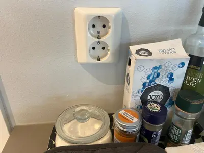 a counter with a light switch and some food at Fin leilighet med parkering! in Bergen