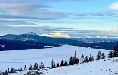 a view of a snow covered mountain with a lake at Gorgeous Home In Gålå With Sauna in Gålå