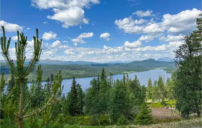 a view of a lake in the middle of trees at Gorgeous Home In Gålå With Sauna in Gålå